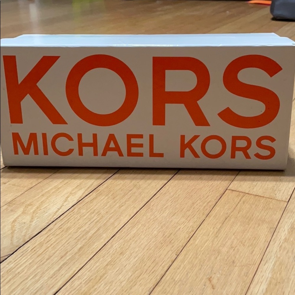 Neon Pink parent leather flats from Michael Kors.